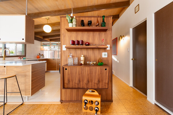 Cream Modern fashioned completely custom wooden cabinetry for the kitchen.