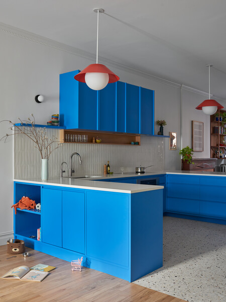 The cabinetry on this side of the kitchen is painted Farrow &amp; Ball's "Pea Flower Tea.