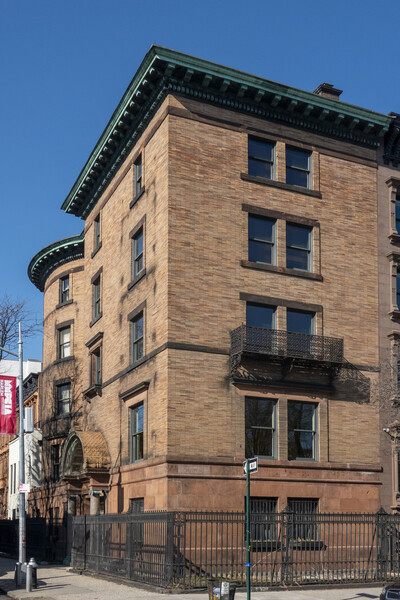 The townhouse sits on 123rd St, across from Harlem's Marcus Garvey Park.